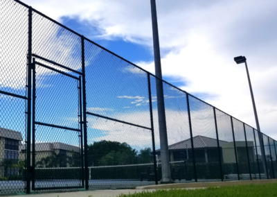 Chain link fence-Green vinyl coated – tennis court fence-Location Hidden Lake Villas – Park Shore Dr, Naples Fl 34103